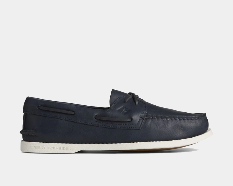 Sperry Authentic Original™ Cross Lace boat shoes in navy leather with moc-toe stitching and white rubber sole, side view.