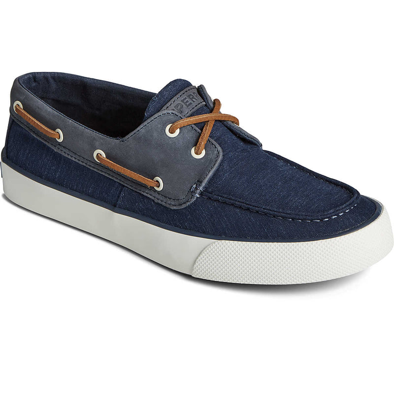 Sperry Bahama II Linen Sneaker in navy blue with tan leather laces, canvas upper, and white rubber outsole, side angle view.