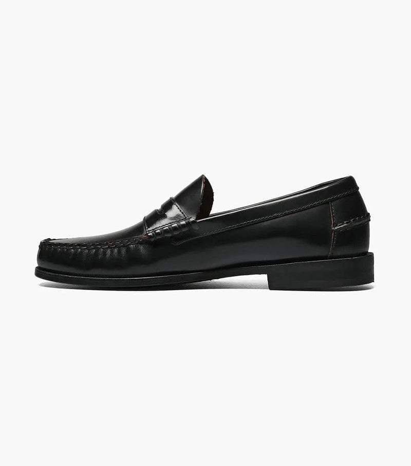 Florsheim Berkley Penny Loafer dress shoes in glossy black leather with moc-toe stitching and classic penny strap, side view.