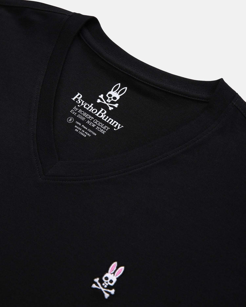 Psycho Bunny Big and Tall Classic V Neck Tee in black, featuring embroidered logo with pink and white details, close-up view of neckline and branding.