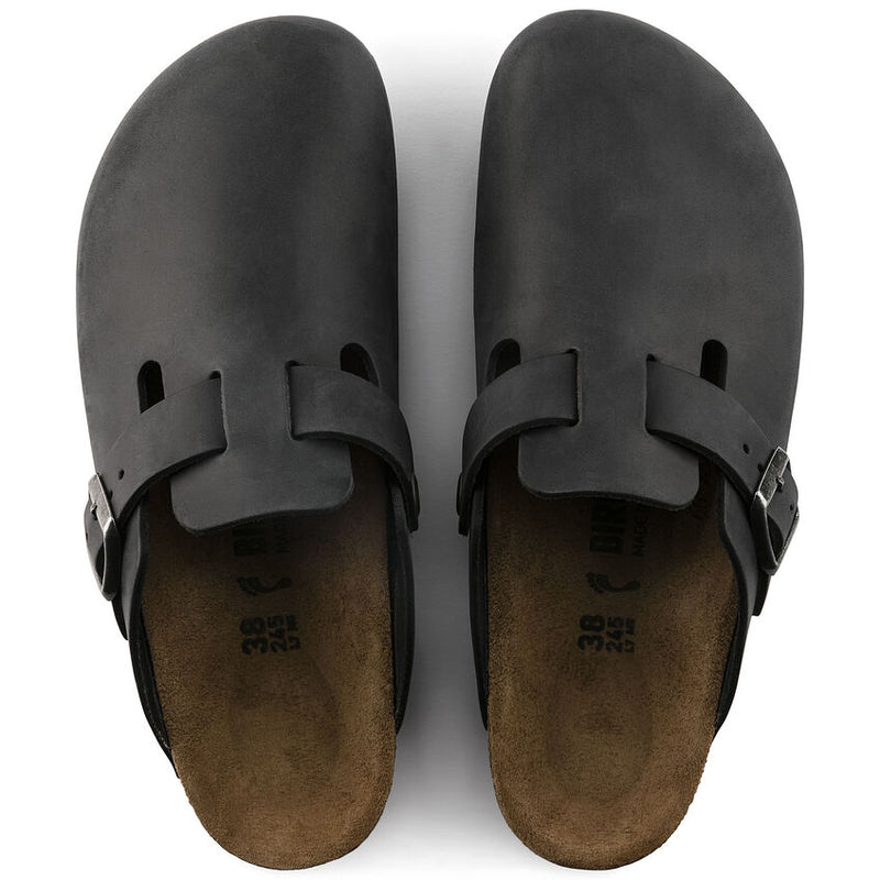 Birkenstock Boston Oiled Leather clogs in black with adjustable strap and suede footbed, top view.