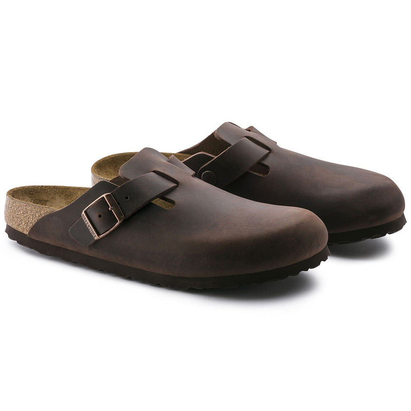 Birkenstock Boston Oiled Leather clogs in dark brown with adjustable buckle strap and contoured cork footbed, angled front view.