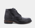 Bed Stu Bradley boots in distressed black leather with lace-up design and rustic wooden sole, side view.