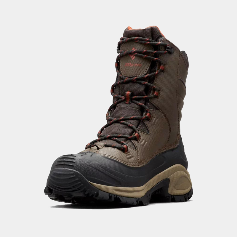 Columbia Bugaboot III winter boots in brown with rubber outsole, waterproof construction, and red-accented laces, angled front view.