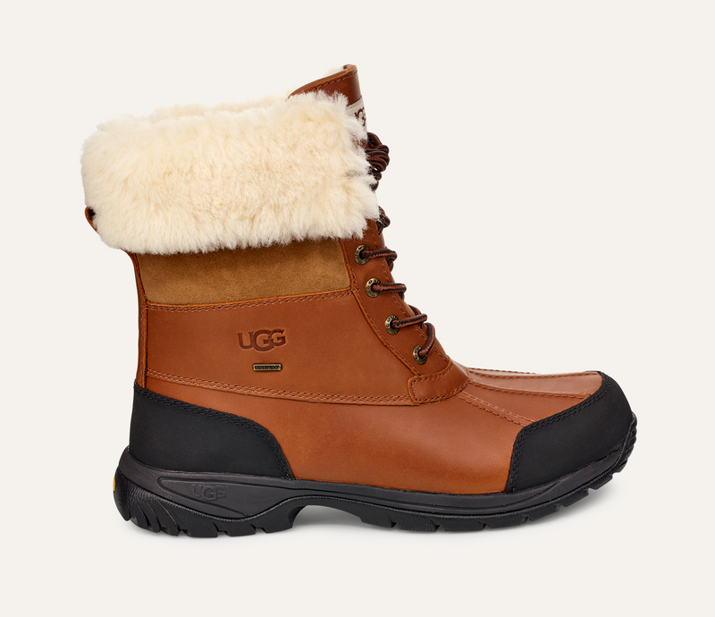 UGG Butte boots in chestnut leather with waterproof finish, wool-lined collar, and black rubber outsole, side view.