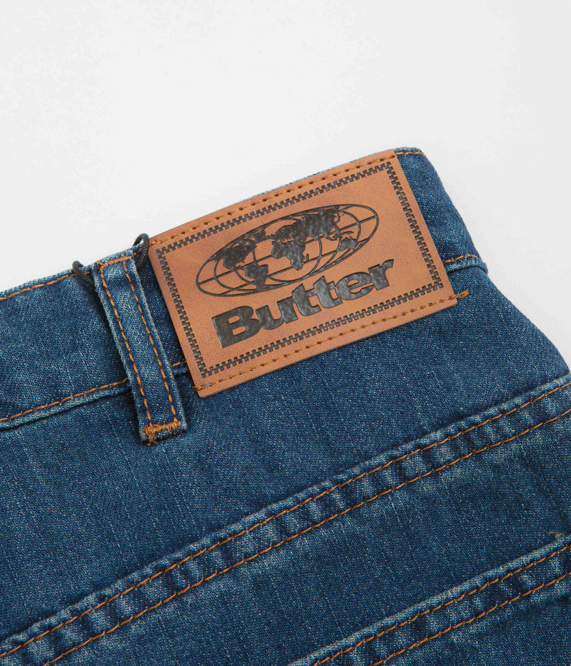 Butter Goods x Peanuts Spike Denim Jeans in Distressed Indigo