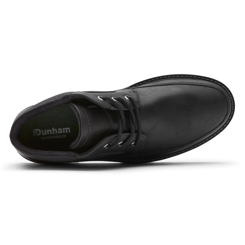 Dunham Byrne Waterproof Chukka Boot in black leather with lace-up design and branding on footbed, top view.