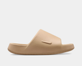 Nike Calm Slide 2.0 sandals in beige with textured footbed and embossed Nike logo, side view.