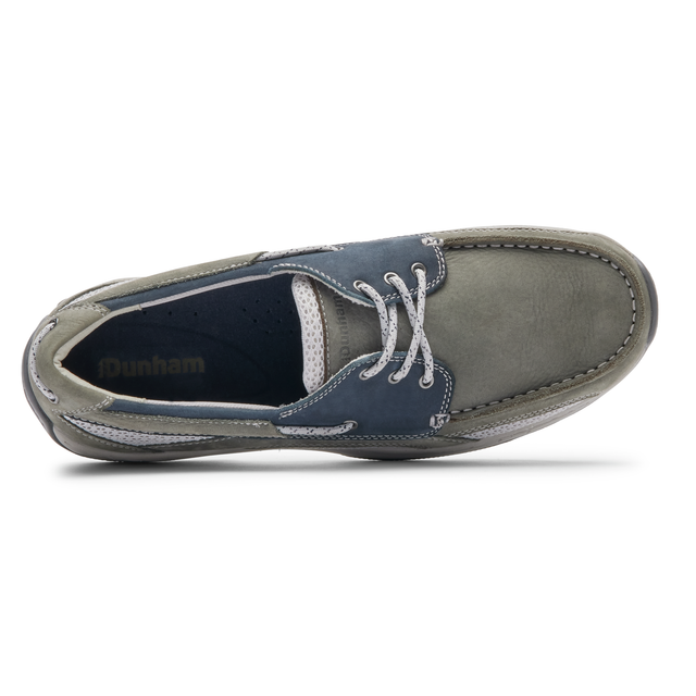 Dunham Captain boat shoes top view in gray and navy leather with white stitching and lace-up design.