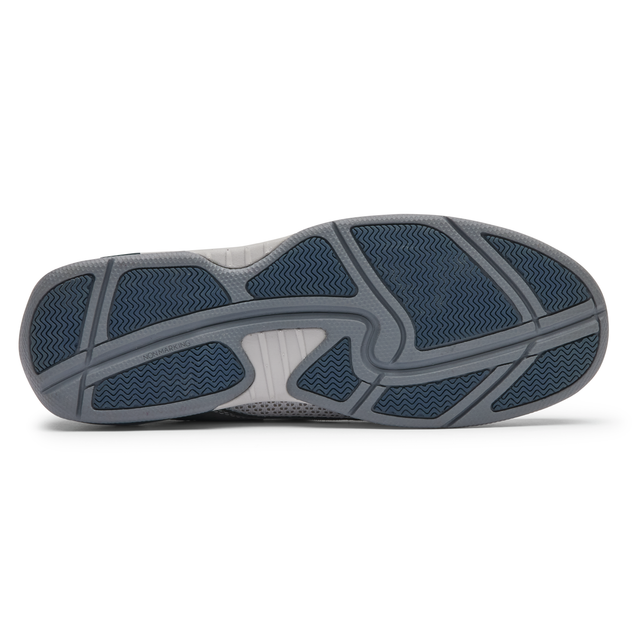 Dunham Captain shoe outsole featuring a gray and navy rubber design with wave-patterned traction and flex grooves, bottom view.