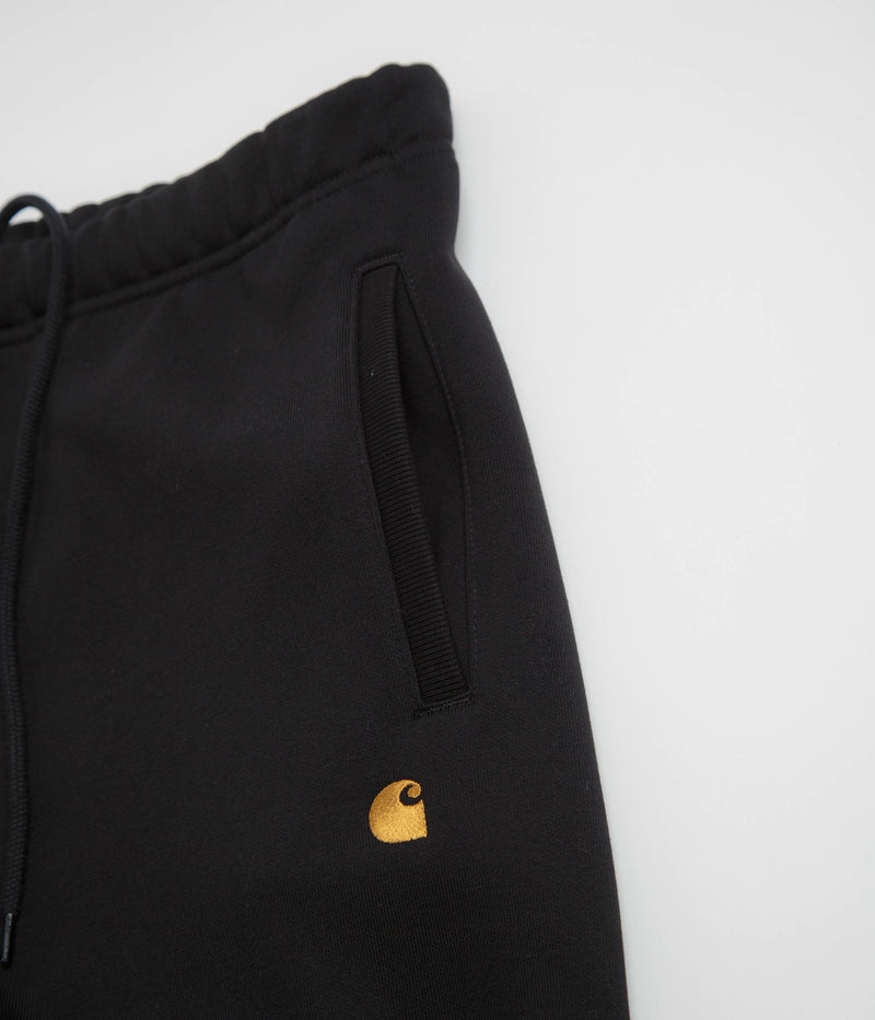 Carhartt Chase Sweatpants in Black and Gold