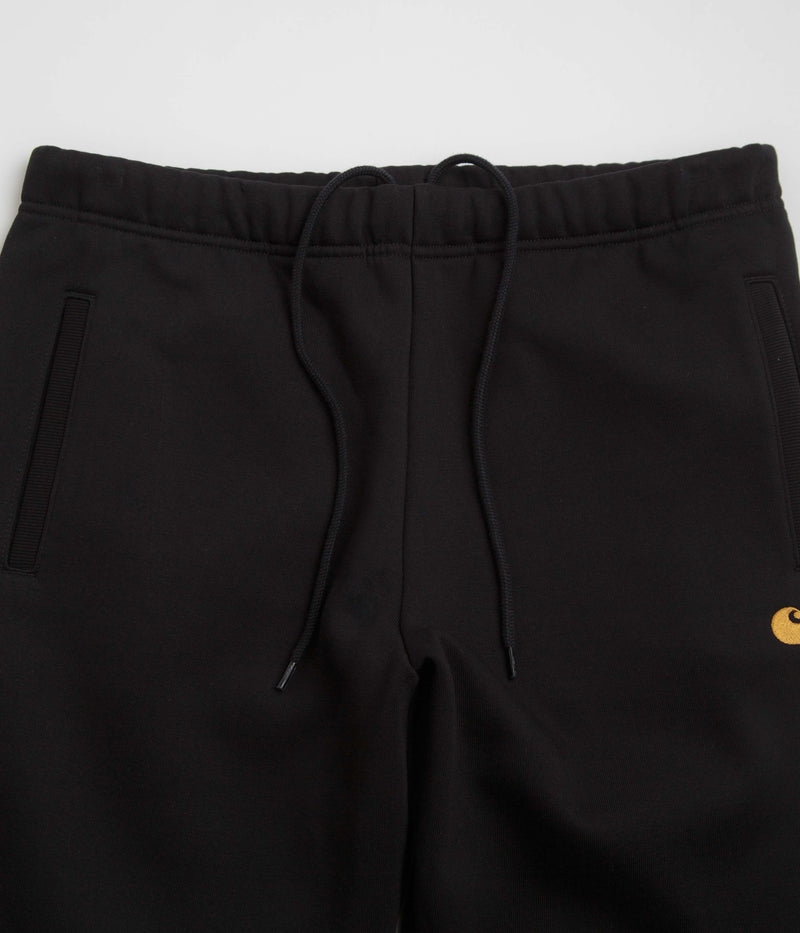 Carhartt Chase Sweatpants in Black and Gold