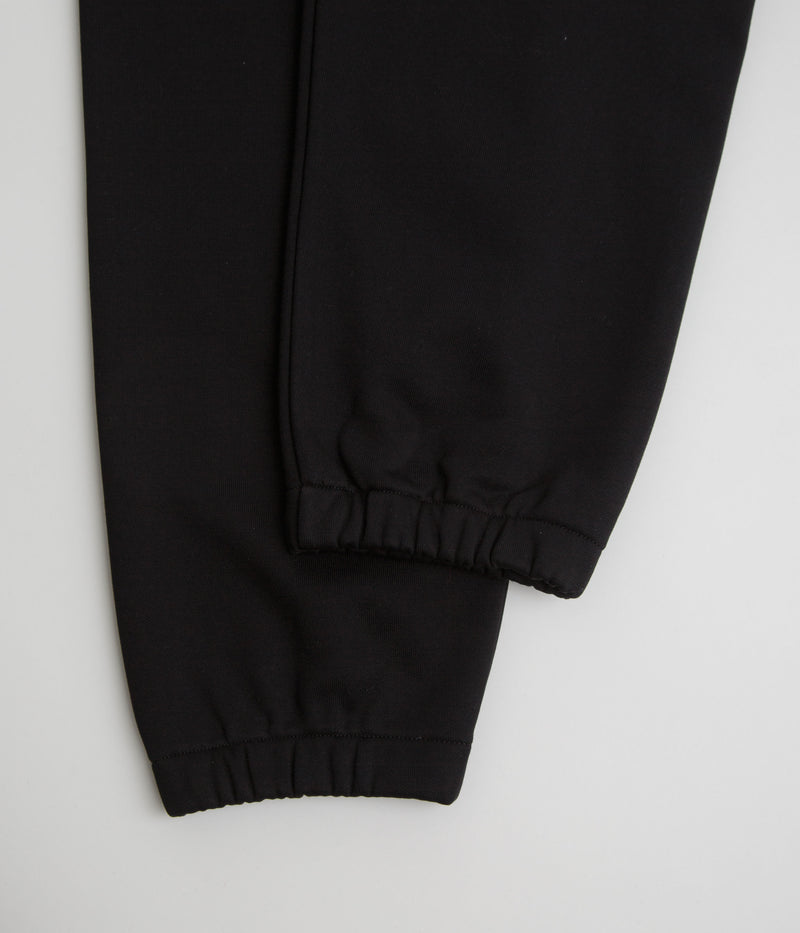 Carhartt Chase Sweatpants in Black and Gold