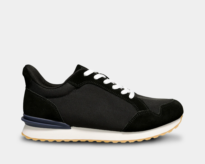 Propét Carmine Step In Sneakers in black with a breathable mesh upper, suede overlays, white laces, and a lightweight outsole, side view.