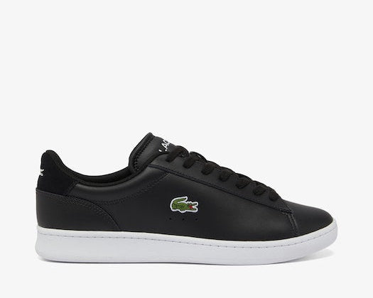Lacoste Carnaby Set Leather Sneakers in black with white sole, embroidered crocodile logo, and lace-up closure, side view.