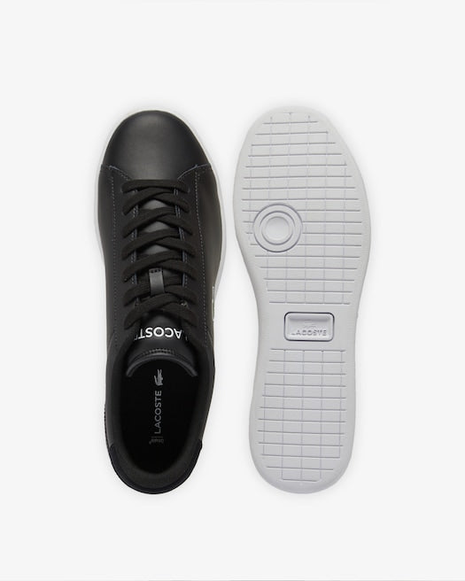 Lacoste Carnaby Set Leather Sneakers in black with sleek leather upper and white rubber sole, top and sole view.
