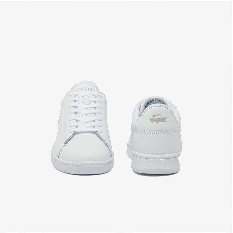 Lacoste Carnaby Set Leather Sneakers in white with tonal laces and embossed crocodile logo on the heel, front and back view.