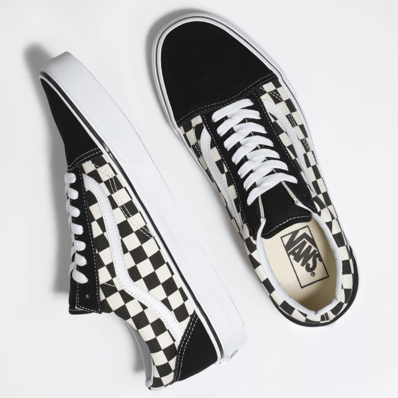 Vans Checkerboard Old Skool sneakers with black suede accents and white and black checkered canvas upper, top view.