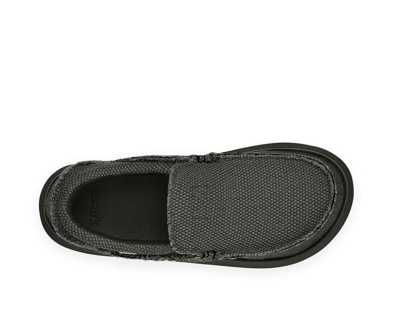Sanuk Chiba slip-on shoes featuring a textured black canvas upper and cushioned footbed, top view.