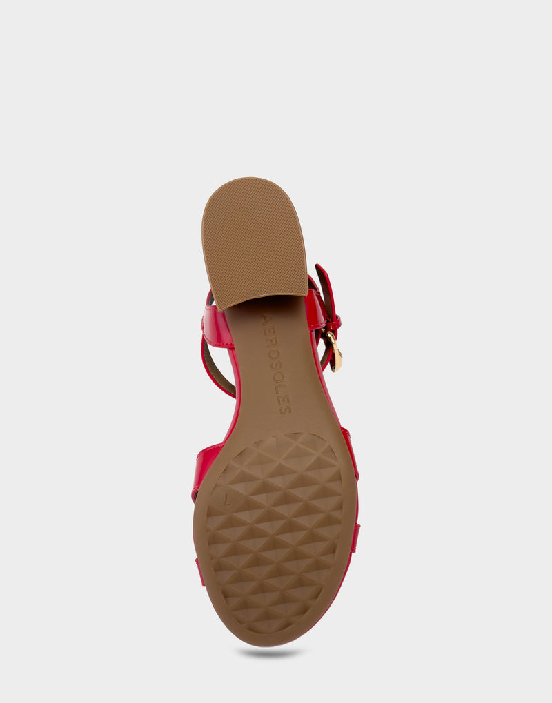 Comfortable Women's Low Heeled Sandal in Red Faux Patent Bottom View