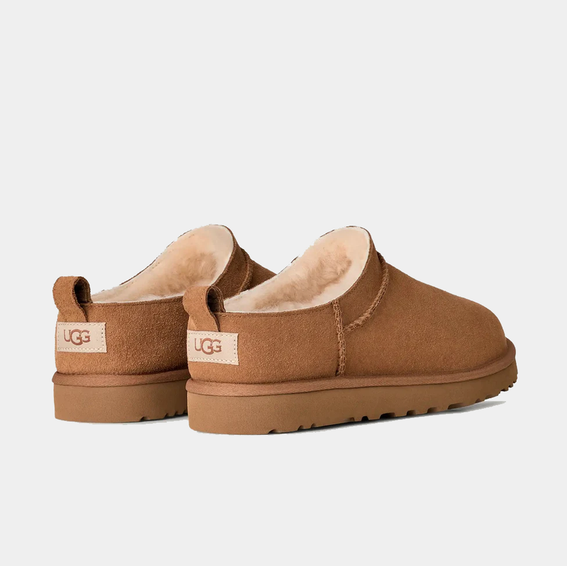 UGG Classic Micro boots in chestnut suede with shearling lining and pull tabs, back angled view.