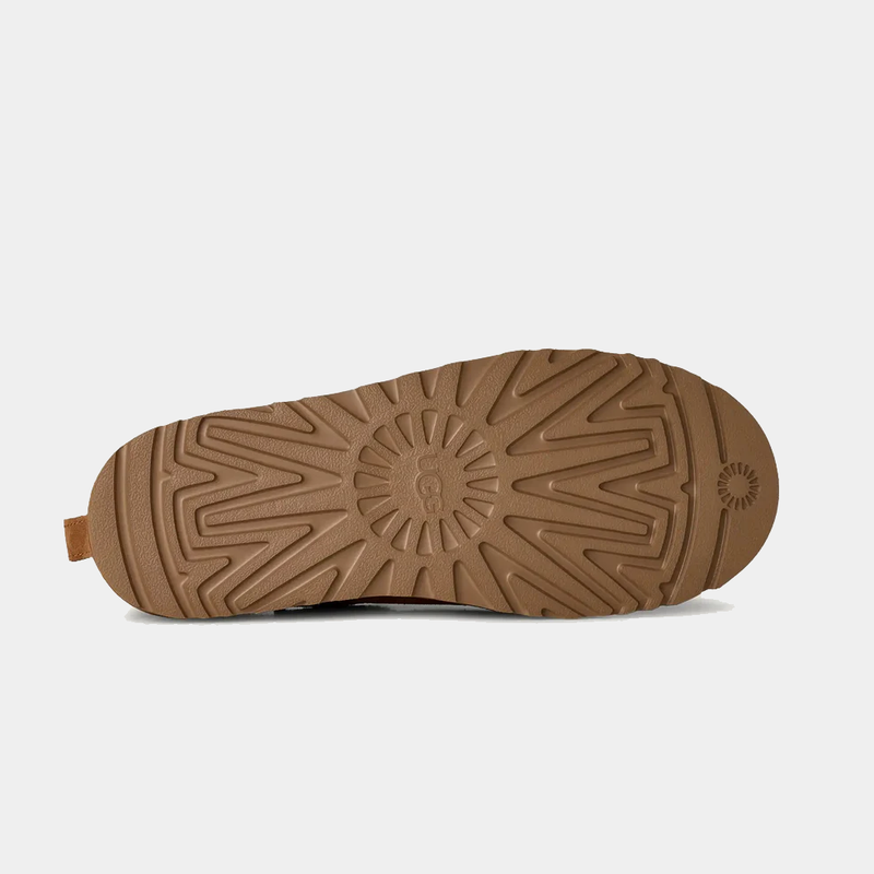 UGG Classic Micro boots outsole in light brown rubber featuring textured tread pattern and UGG logo.