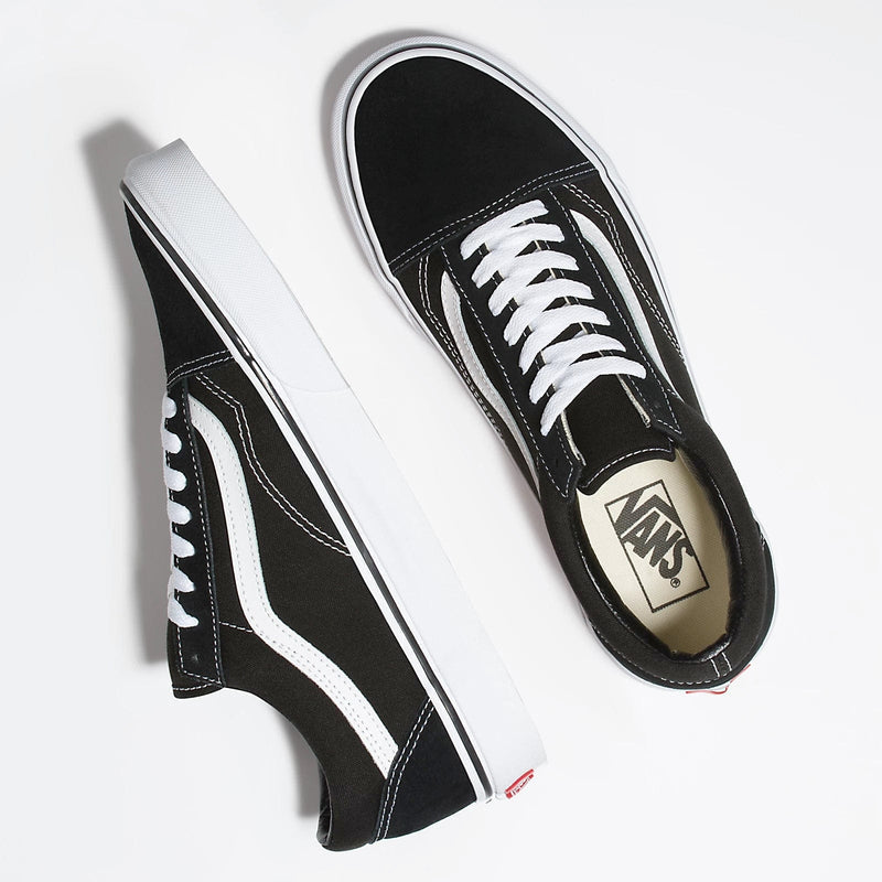 Vans Classic Old Skool sneakers in black with white side stripe, canvas upper, padded collar, and white laces, top view.