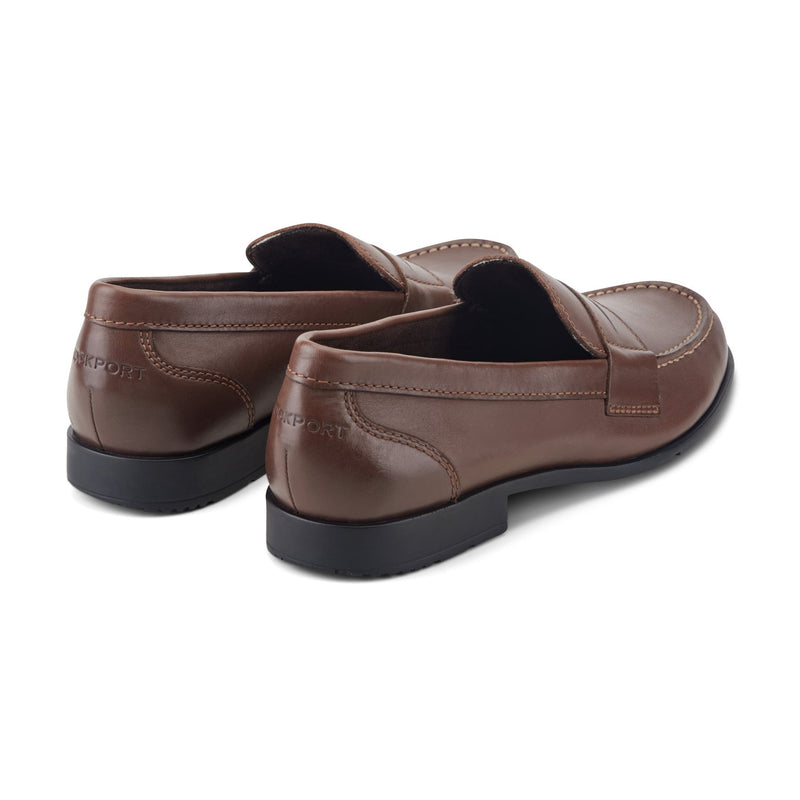 "Rockport Classic Penny Loafers brown leather with stitched details and black soles, back view"