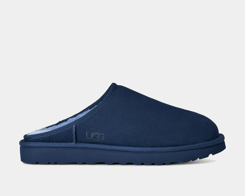 UGG Classic Slip-On shoes in navy blue with suede upper and plush lining, side view.