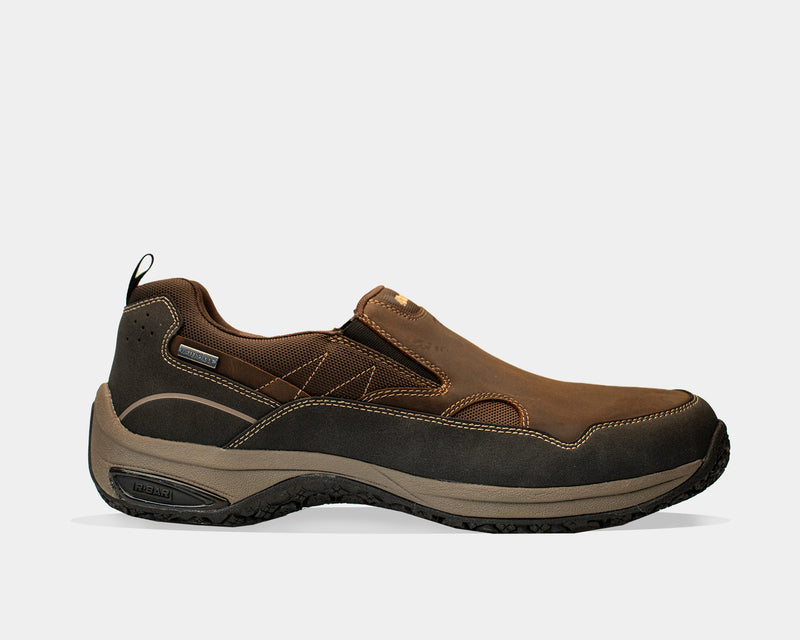 Dunham Cloud Plus Waterproof Slip-On shoes in brown with leather upper, elastic gore panels, and durable rubber outsole, side view.