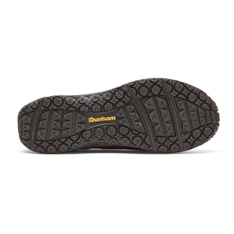Dunham Cloud Plus Waterproof Slip-On shoe outsole in black with textured grip pattern and Dunham logo in yellow.