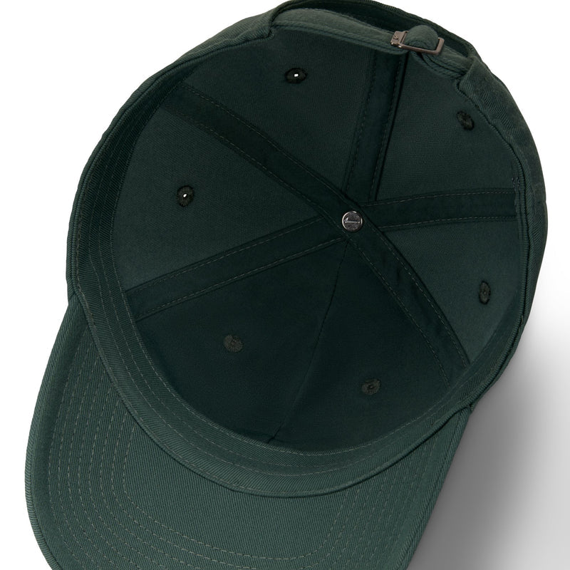 Nike Club Hat in dark green with stitched eyelets and adjustable buckle strap, inside view showcasing panel construction.