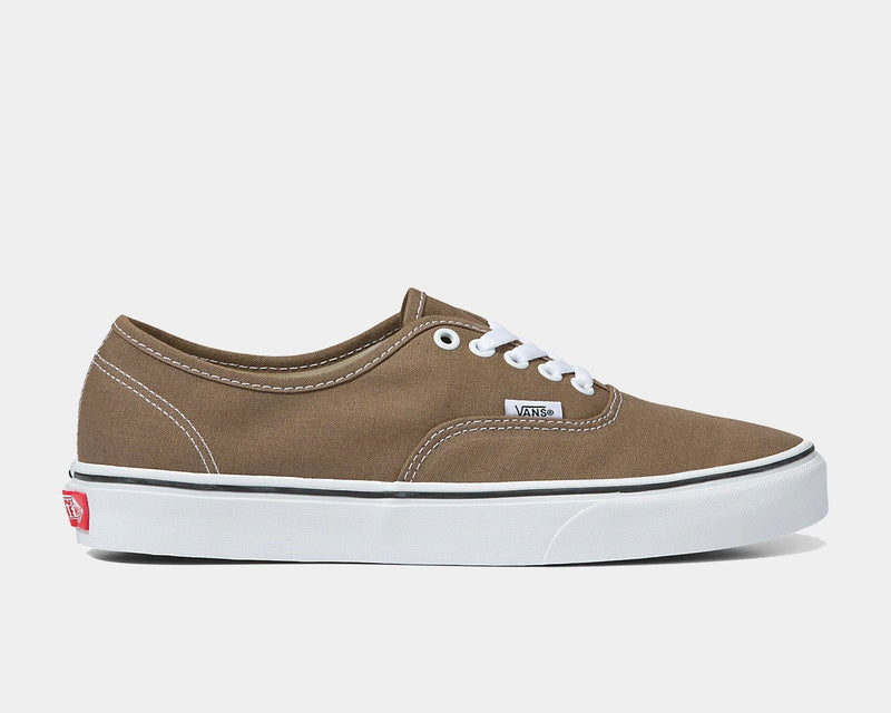 Vans Color Theory Authentic shoes in tan canvas with white laces, white rubber sole, and black stripe detail, side view.