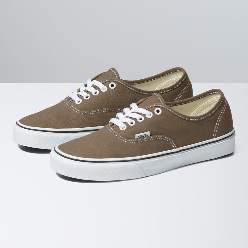 Vans Color Theory Authentic shoes in brown canvas with white stitching, metal eyelets, and white rubber outsole, angled view