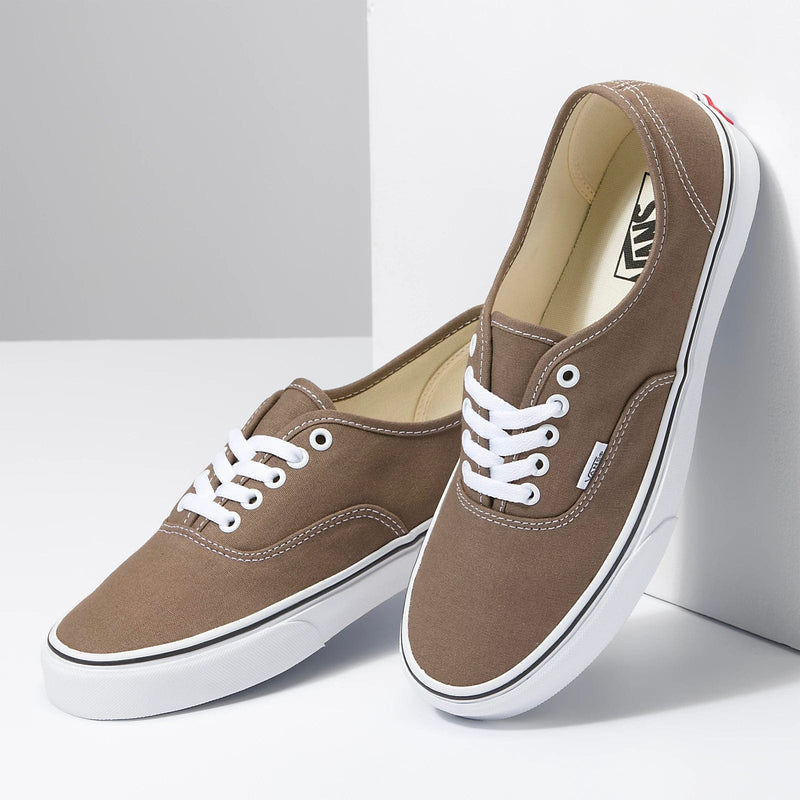 Vans Color Theory Authentic shoes in brown canvas with white laces and a low-profile design, angled front-side view.