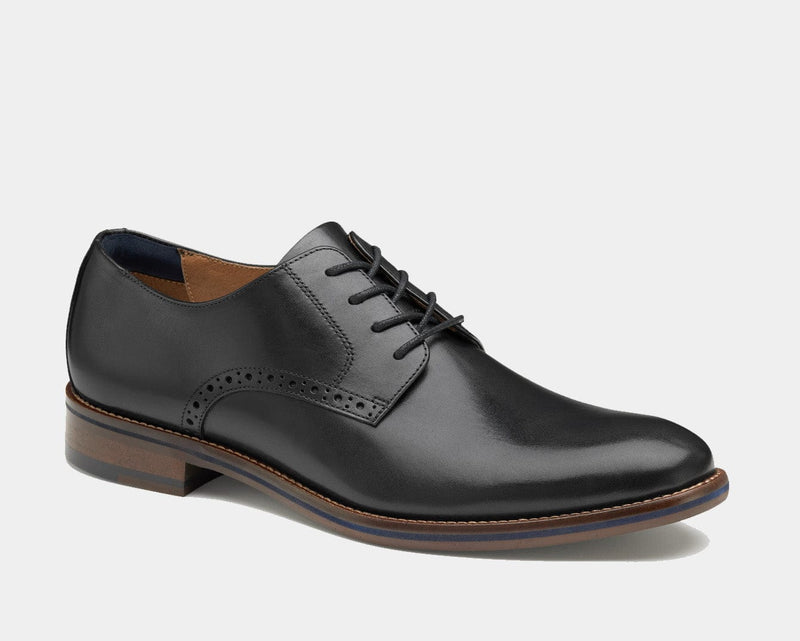 Johnston & Murphy Conard 2.0 Plain Toe dress shoes in black leather with brogue detailing and stacked wooden heel, side view.