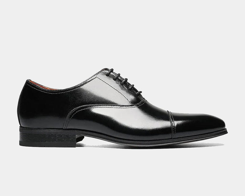 Florsheim Corbetta dress shoes in glossy black leather with a cap-toe design and lace-up closure, side view.