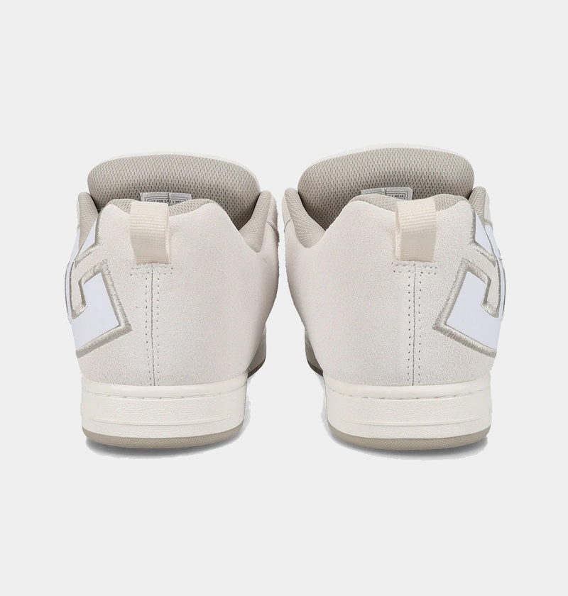 DC Footwear Court Graffik SE skate shoes in light beige with oversized logo details, back view showing heel design and pull tabs.
