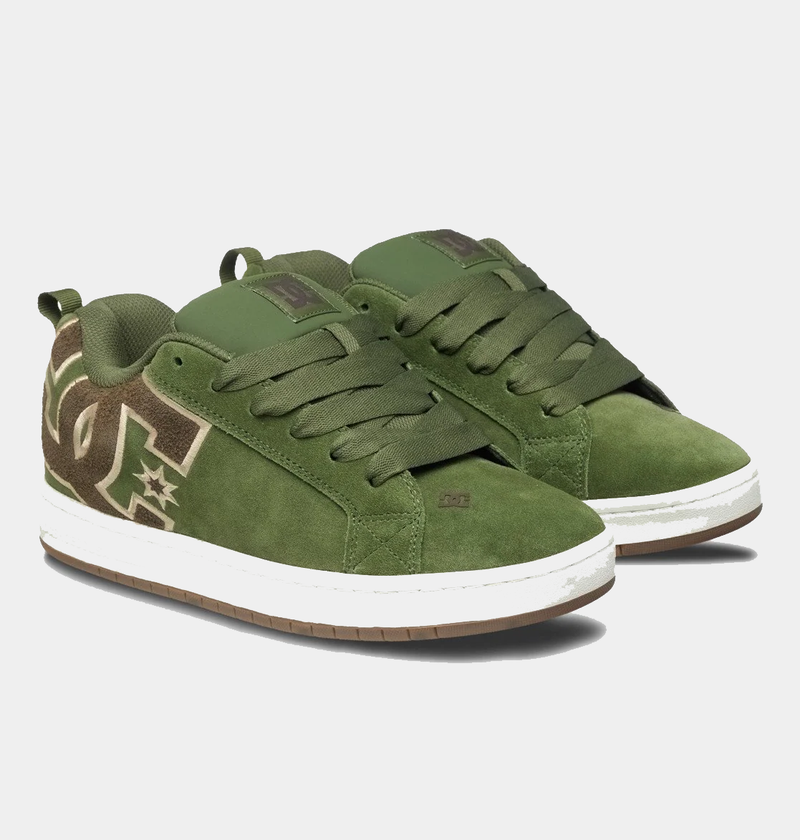 DC Footwear Court Graffik SE sneakers in olive green suede with oversized logo detailing, white midsole, and gum outsole, angled front view.