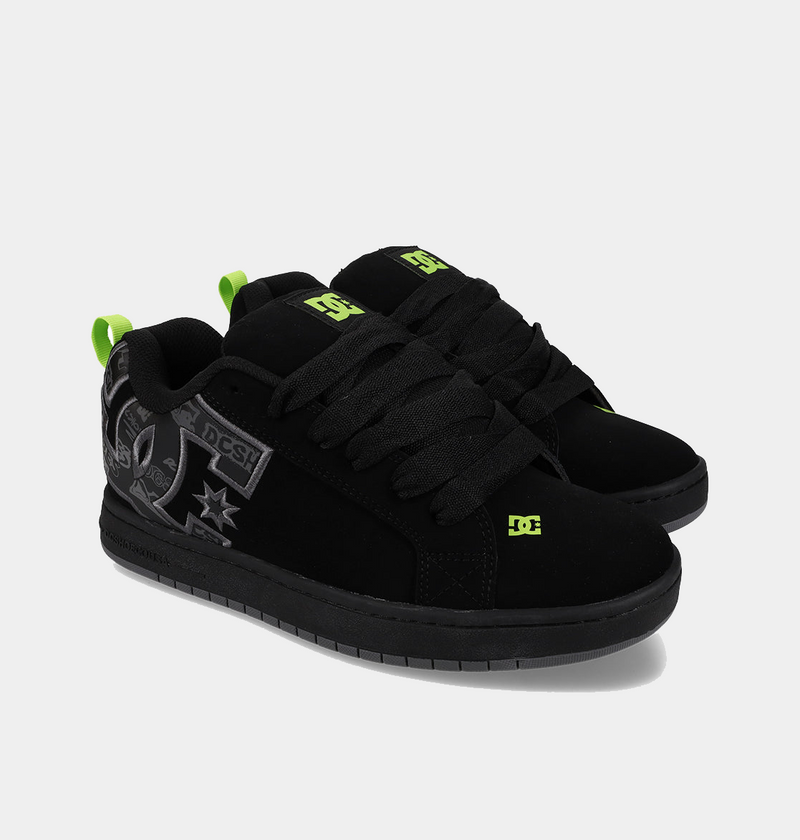 DC Footwear Court Graffik skate shoes in black with neon green logo accents and graffiti-style graphic details, angled side view.