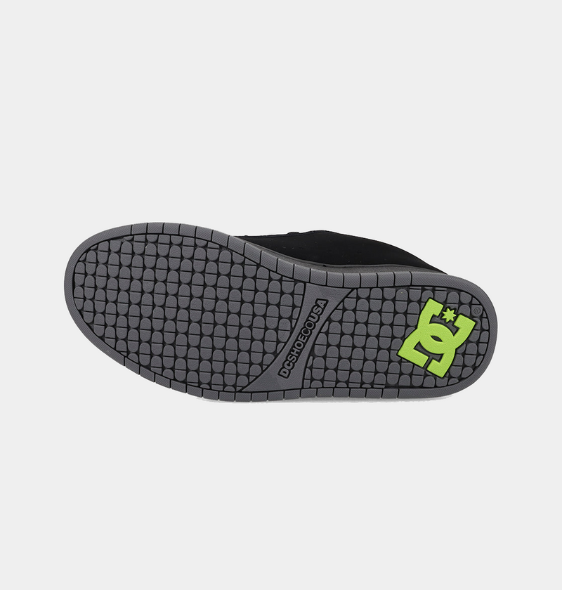 DC Footwear Court Graffik skate shoes outsole in gray rubber with textured tread pattern and green DC logo, bottom view.