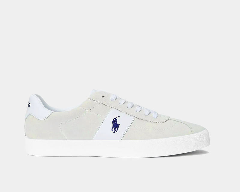An all white suede sneaker with a black logo.