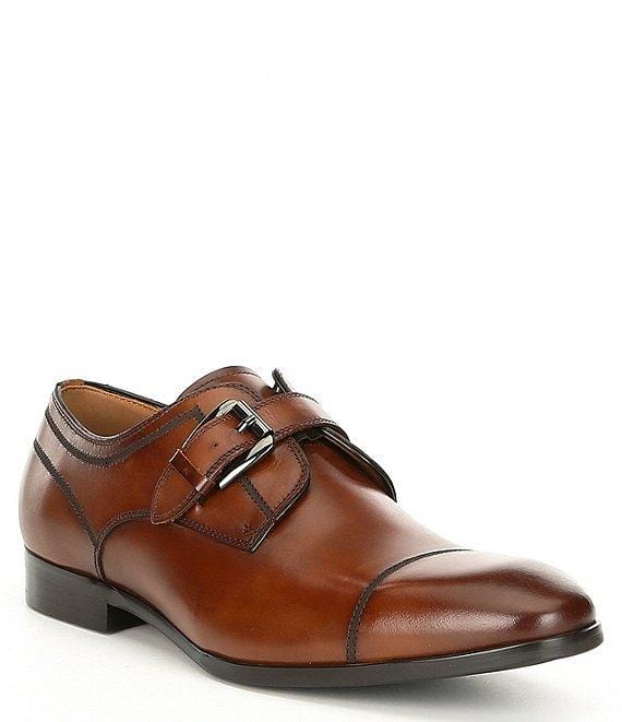 Steve Madden Covet dress shoe in brown leather with cap-toe design, double monk strap closure, and low stacked heel, side view.