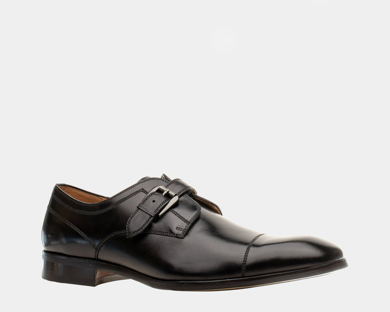 Steve Madden Covet dress shoes in black leather with a cap toe and double monk strap, side view.