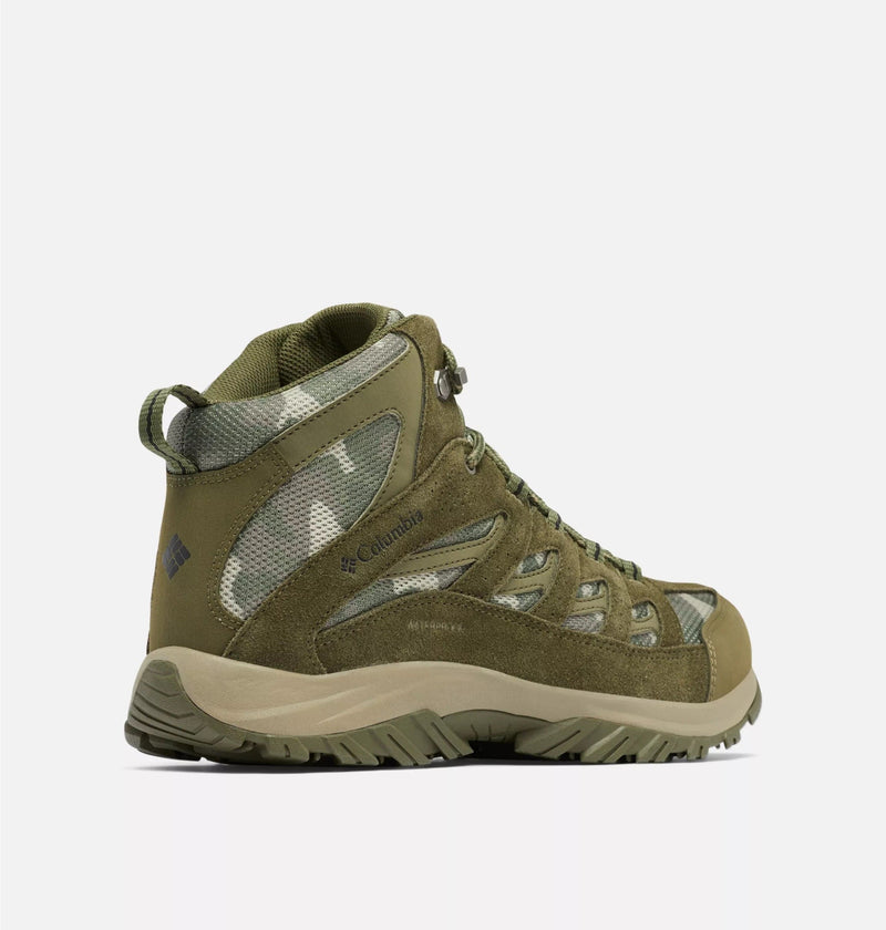 Columbia Crestwood Mid Waterproof hiking boots in olive green with suede overlays and mesh panels, side view showcasing rugged sole and waterproof construction.