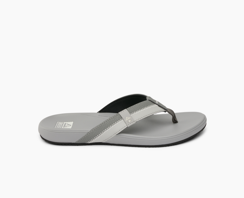 Reef Cushion Phantom 2.0 sandals in light gray with soft padded straps and cushioned footbed, side view.