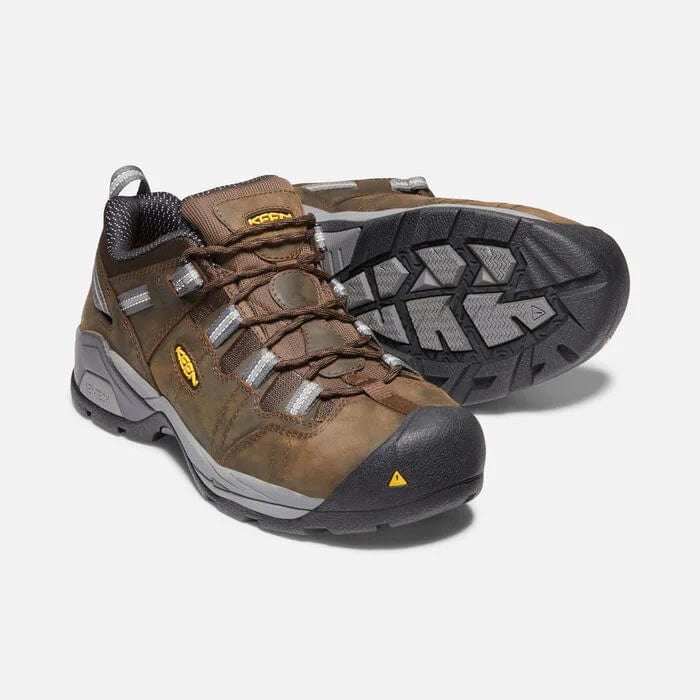 Keen Detroit XT Steel Toe ESD work shoes in brown leather with gray accents, rugged outsole, and protective steel toe, angled front and sole view.