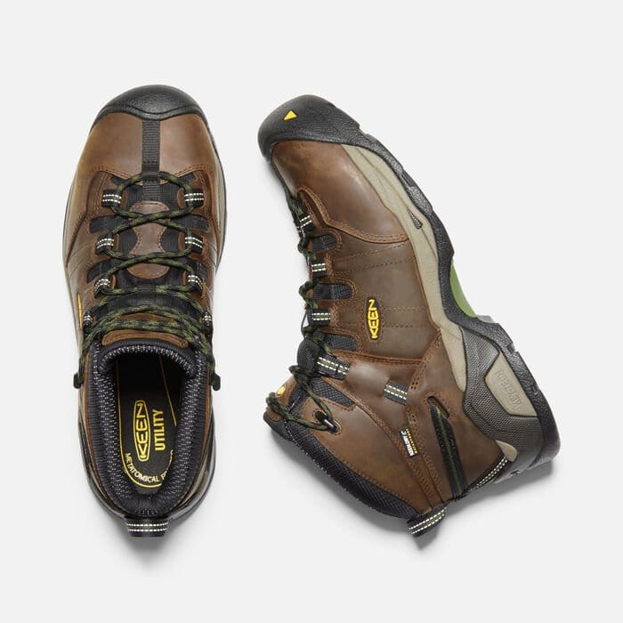 Keen Detroit XT Steel Toe Mid Waterproof Boots in brown leather with black accents, green details, and rugged outsole, top and side view.