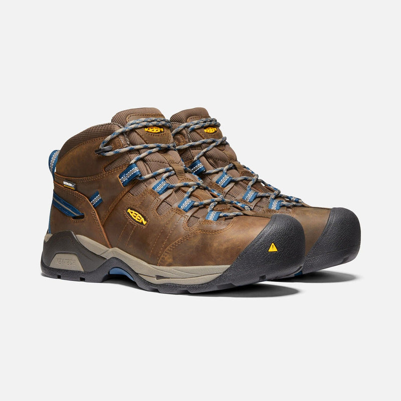 Keen Detroit XT Steel Toe Mid Waterproof Boots in brown leather with blue accents and durable lace system, front angle view.