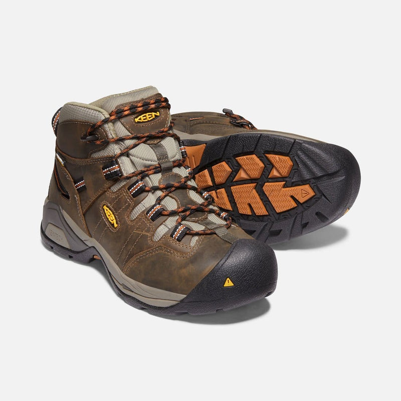 Keen Detroit XT Waterproof Boot in brown leather with reinforced toe, orange accents, and durable outsole, front and sole view.